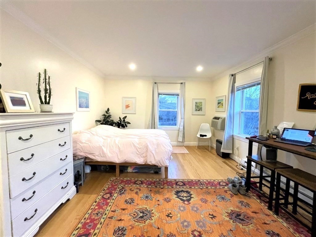 31 Cedar Street, Unit 1 Cambridge, MA 02140 - Photo 4 of 5 a bed room with a bed and a dresser