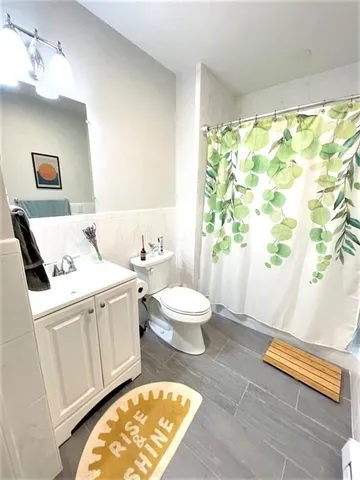 a living room with a bed and a table