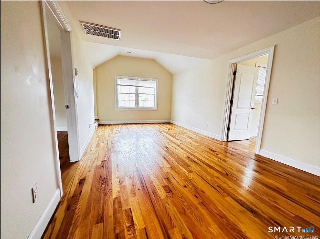 31 Brainerd Road, Unit 2 Branford, CT 06405 - Photo 13 of 15 a view of empty room with wooden floor