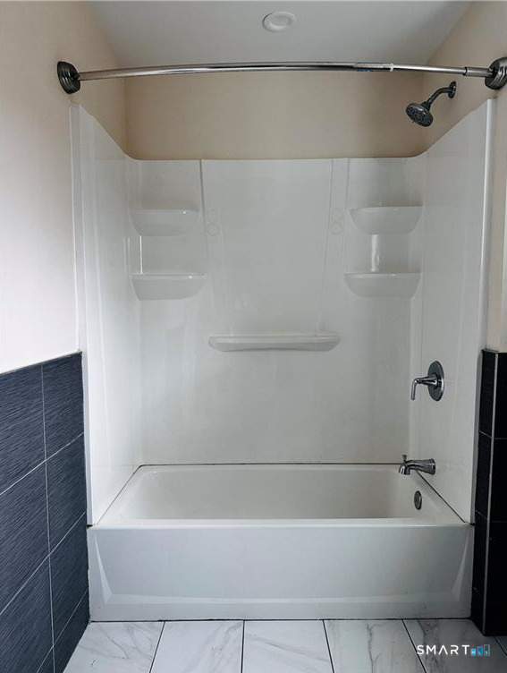 31 Brainerd Road, Unit 2 Branford, CT 06405 - Photo 6 of 15 a bathroom with a bathtub