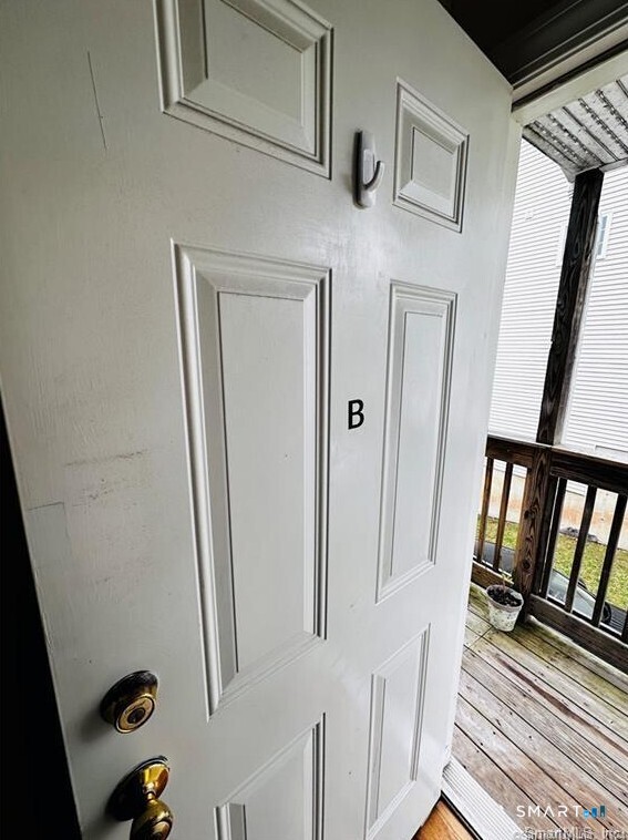 31 Brainerd Road, Unit 2 Branford, CT 06405 - Photo 8 of 15 a view of a door with a glass door