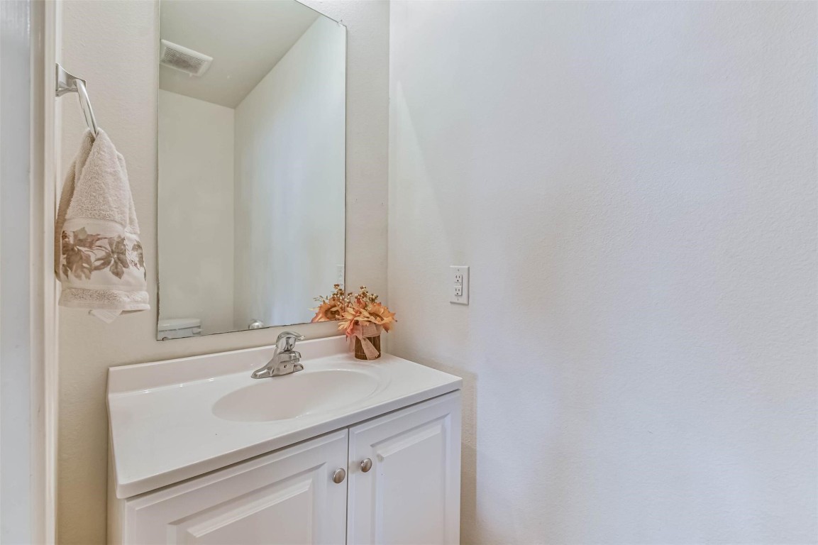2050 Wilde Elm Houston, TX 77090 - Photo 11 of 19 a bathroom with a sink and a mirror