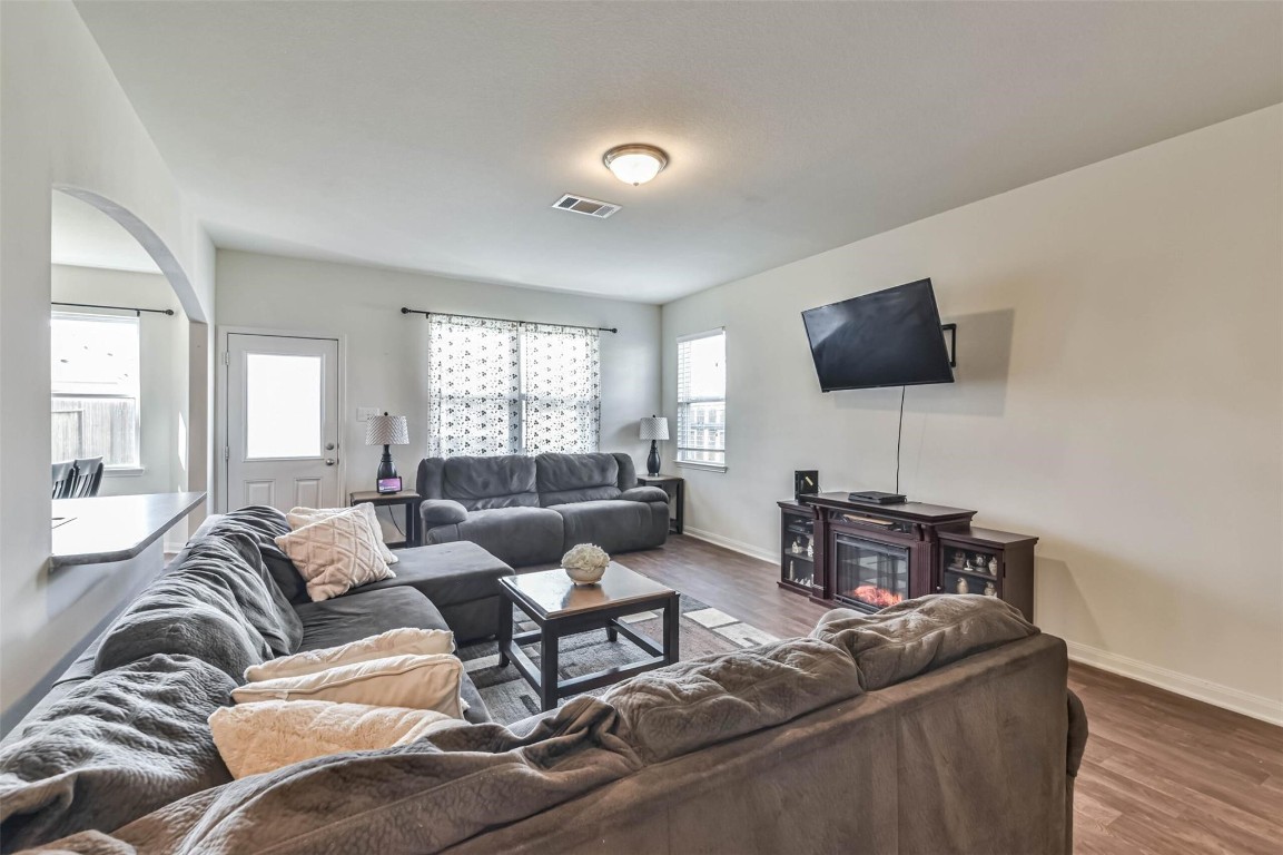 2050 Wilde Elm Houston, TX 77090 - Photo 3 of 19 a living room with furniture and a flat screen tv