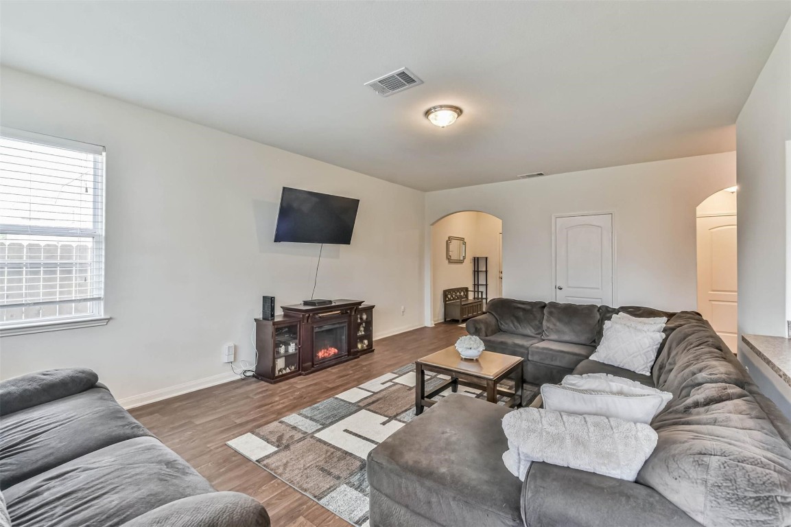 2050 Wilde Elm Houston, TX 77090 - Photo 4 of 19 a living room with furniture and a flat screen tv