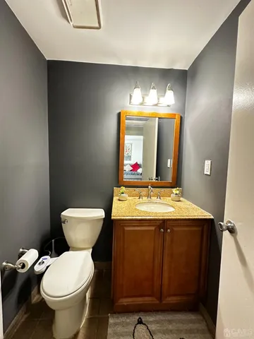 a room with a stove and a mirror