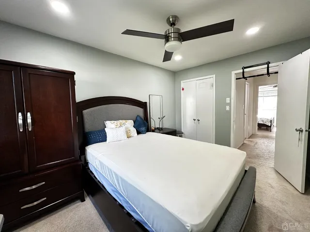 a bedroom with a bed and a walk in closet