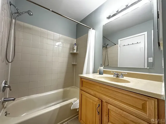 a bathroom with a bathtub and a sink