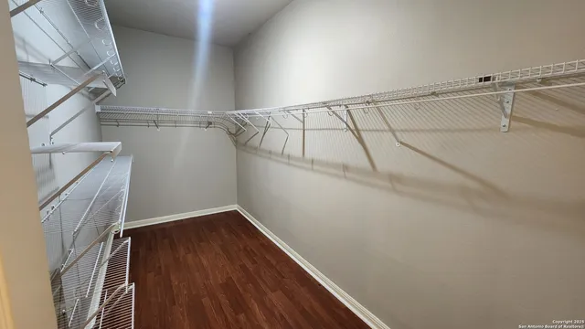 a view of a room with racks on the wall