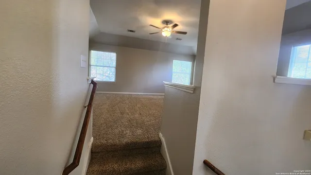 a view of entryway with window and wooden floor