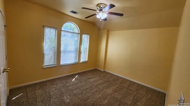 a view of entryway with a fan