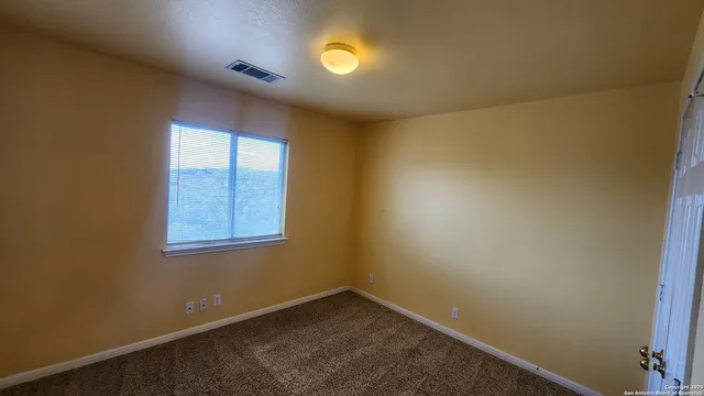 an empty room with a bathroom