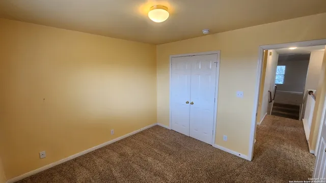 a view of hallway with livingroom