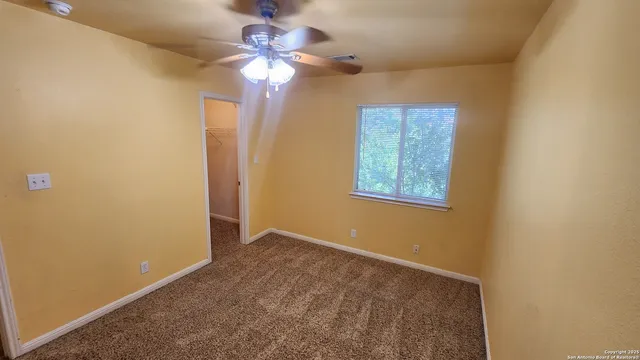 a bathroom with a sink a toilet a mirror and shower