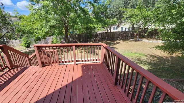a view of a balcony with a pot