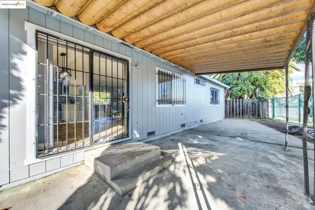a backyard of a house with a fountain