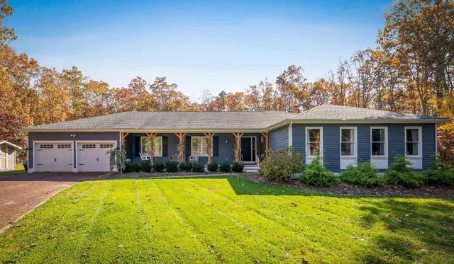 front view of a house with a yard
