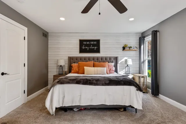 a view of a patio with a dining table and chairs under an umbrella