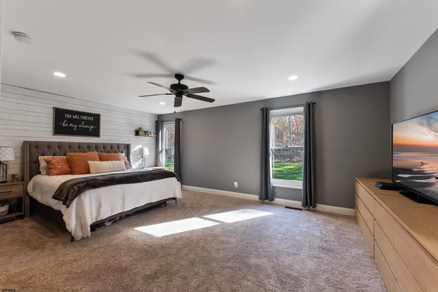 a view of a patio with table and chairs potted plants with wooden floor