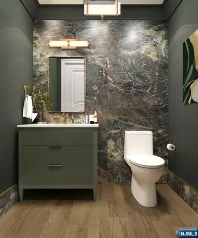a bathroom with a toilet sink and mirror