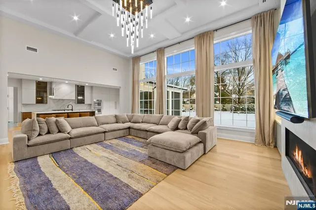 a view of hallway with wooden floor and stairs