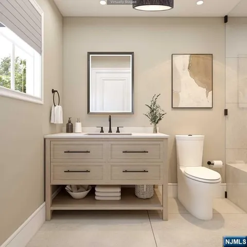 an aerial view of a house with a yard and lake view