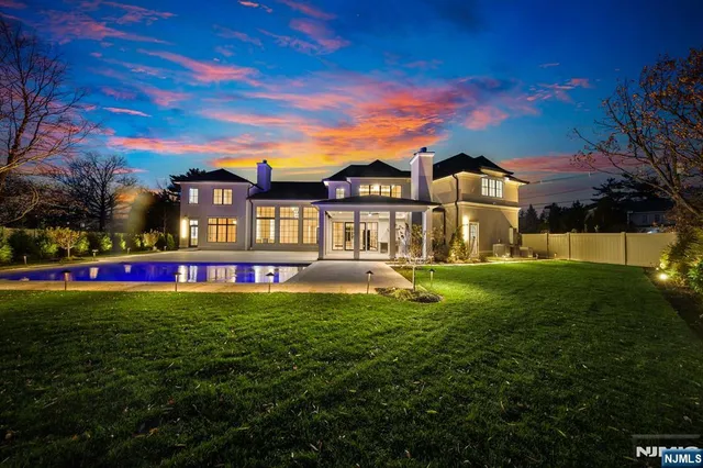 a view of a house with swimming pool