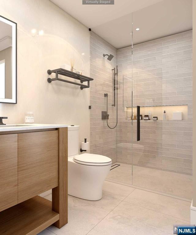 645 Summit Street Englewood Cliffs, NJ 07632 - Photo 21 of 33 a bathroom with a toilet a sink and shower