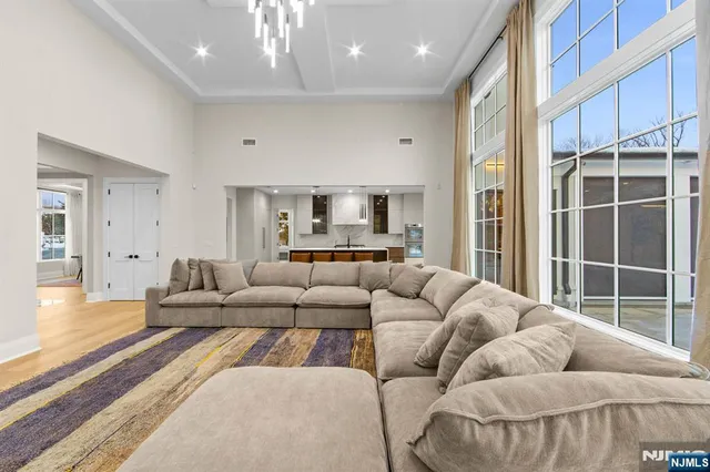 a spacious bathroom with a double vanity sink a mirror and a shower