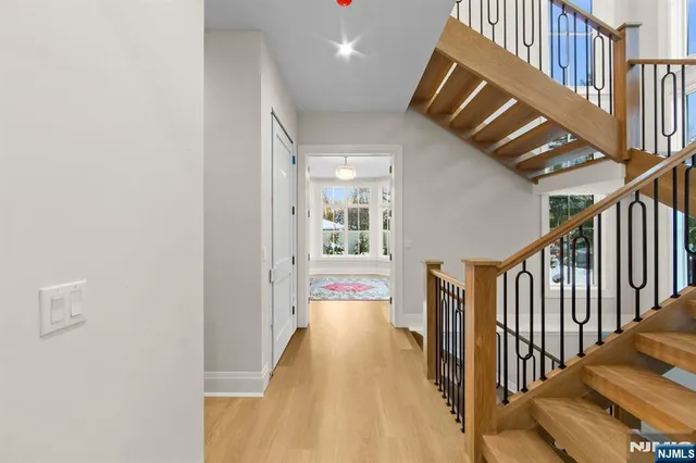 a kitchen with kitchen island a stove and a refrigerator