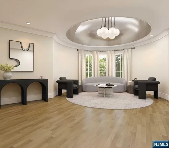 a living room with furniture and wall paintings