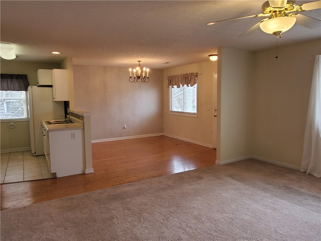 123 Perkins Place Seneca, SC 29678 - Photo 4 of 20 This inviting space combines a functional kitchen area with comfortable living and dining.