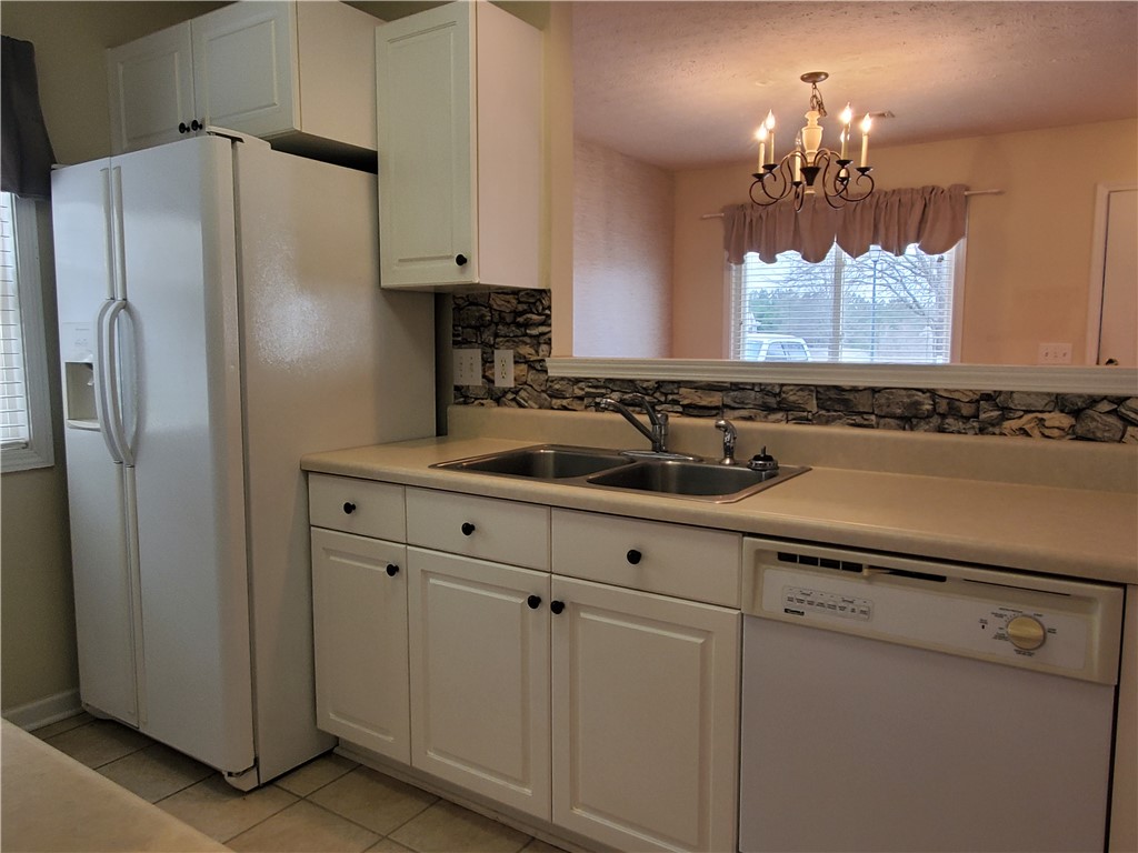 123 Perkins Place Seneca, SC 29678 - Photo 8 of 20 This efficient kitchen offers essential amenities for everyday living.