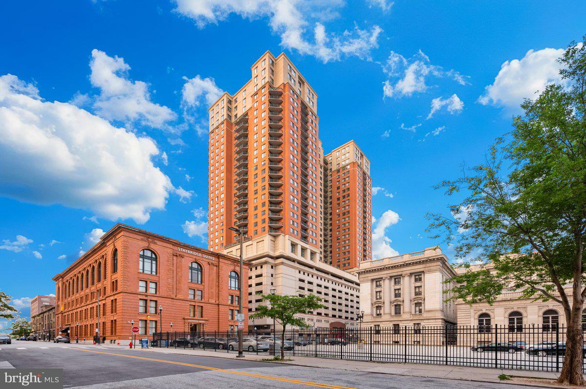 414 Water Street, Unit 2805 Baltimore, MD 21202 - Photo 1 of 26 a view of a tall building next to a road