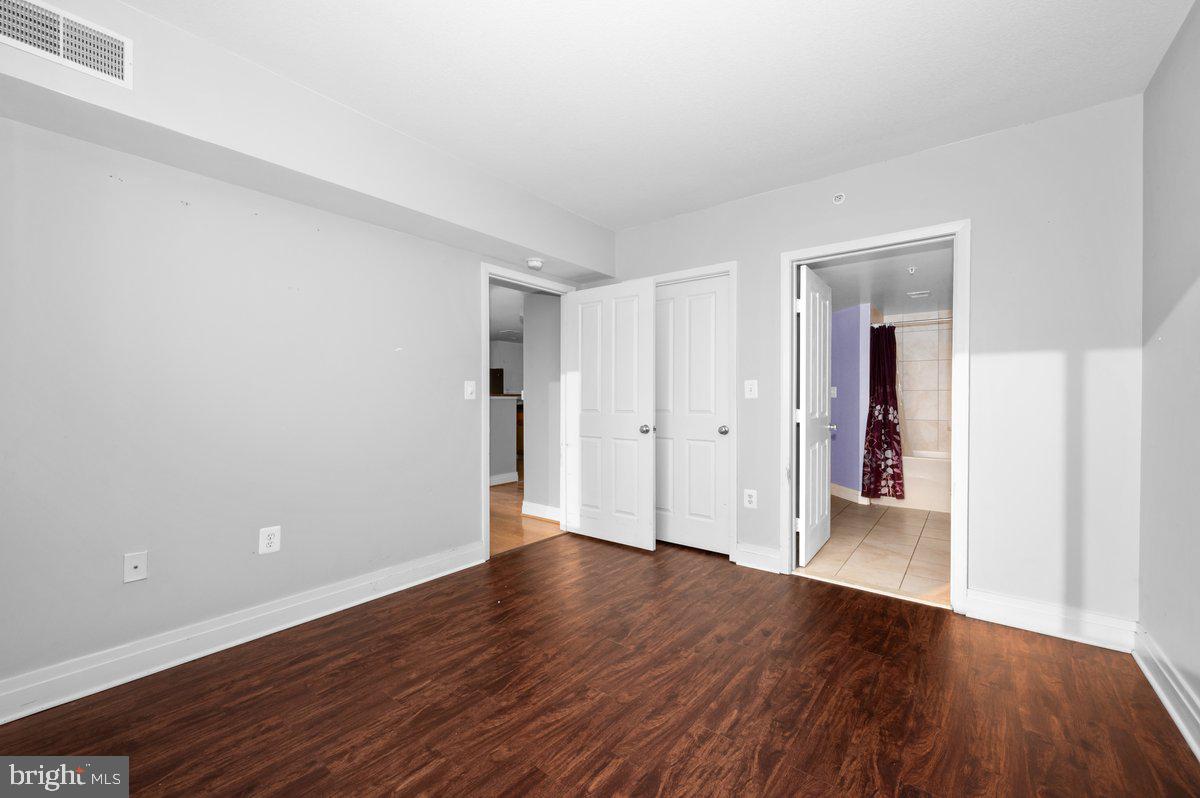 414 Water Street, Unit 2805 Baltimore, MD 21202 - Photo 15 of 26 a view of a room with wooden floor