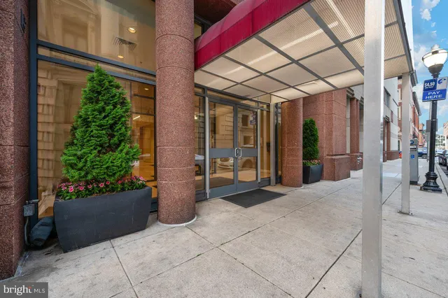 a view of a patio with table and chairs