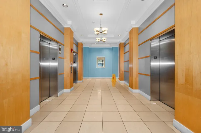 a view of a hallway with a chandelier