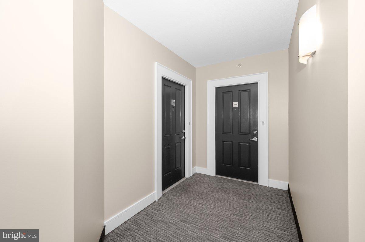 414 Water Street, Unit 2805 Baltimore, MD 21202 - Photo 7 of 26 a view of hallway with wooden floor