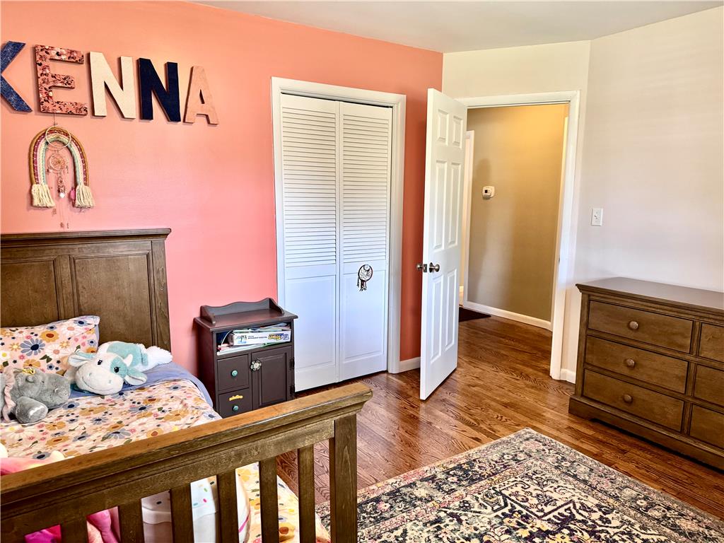 5334 Egypt Road Laurys Station, PA 18059 - Photo 28 of 55 Rich hardwood flooring grounds this inviting bedroom, offering a warm and comfortable retreat.