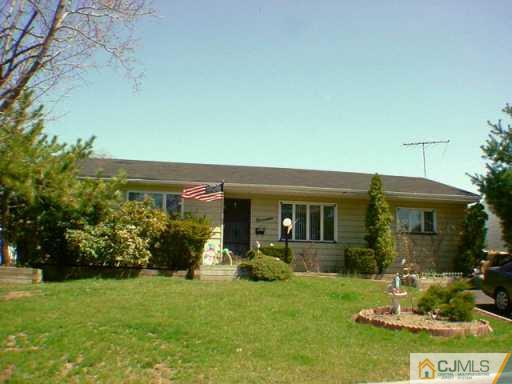 19 Princeton Road Old Bridge, NJ 08859 - Photo 2 of 2 a front view of house and yard with green space