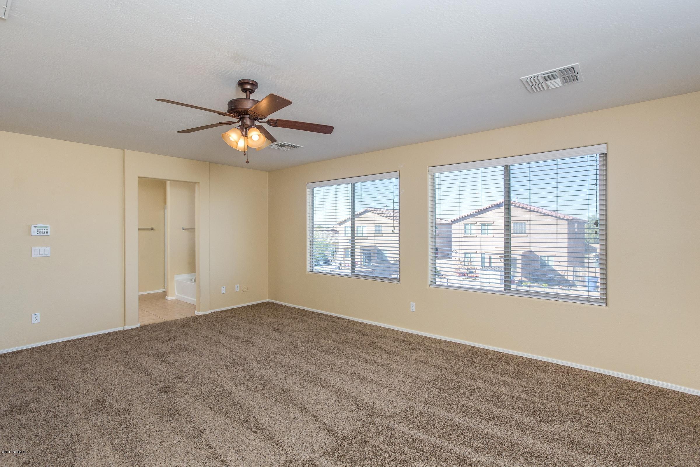7326 West Darrel Road Laveen, AZ 85339 - Photo 8 of 15 a view of an empty room with a window