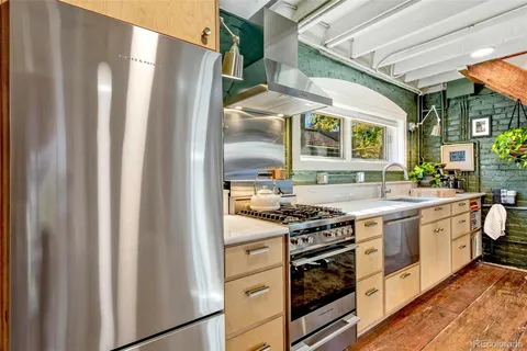 a vase of flowers sitting on a table and chair