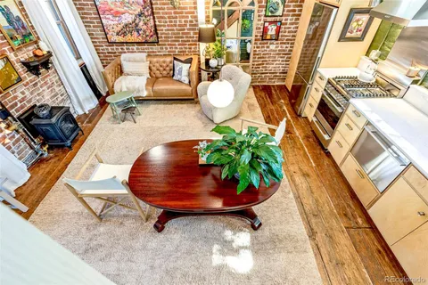 a view of a patio with table and chairs and potted plants