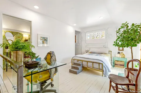 a view of a patio with table and chairs and potted plants
