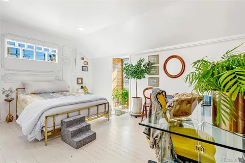 a front view of a house having glass windows