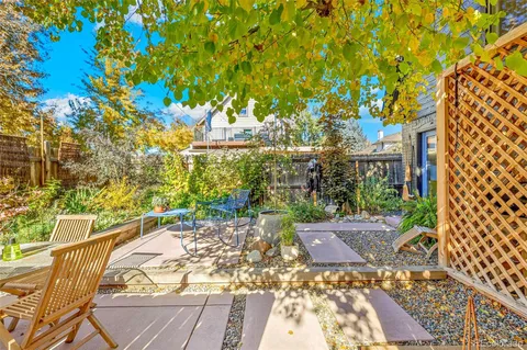 a view of a cafe with a tree