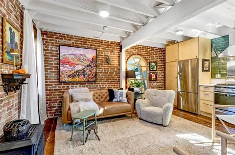 a kitchen with stainless steel appliances granite countertop a stove and a refrigerator