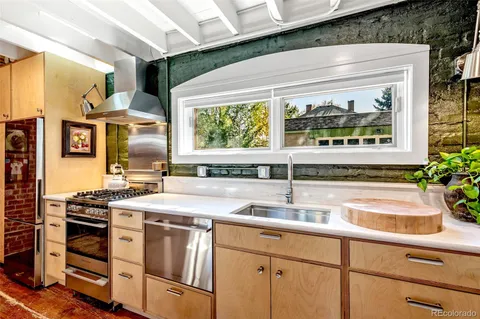 a bedroom with furniture and a potted plant