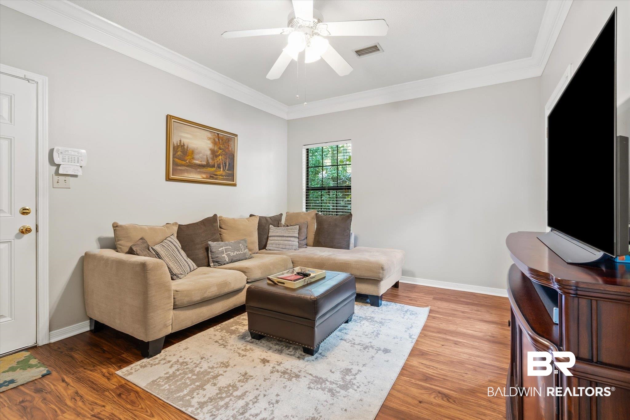 7360 Bridgewood Court Mobile, AL 36695 - Photo 22 of 30 Living room with ceiling fan, ornamental molding, and hardwood / wood-style floors