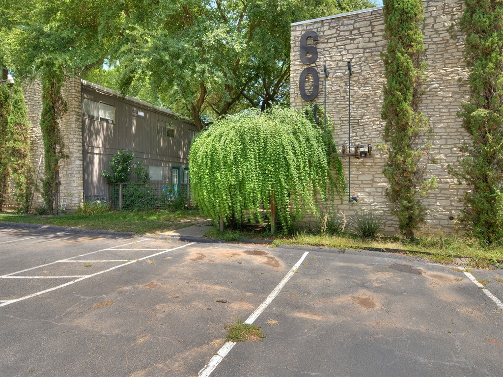 a backyard of a house with lots of green space and trees