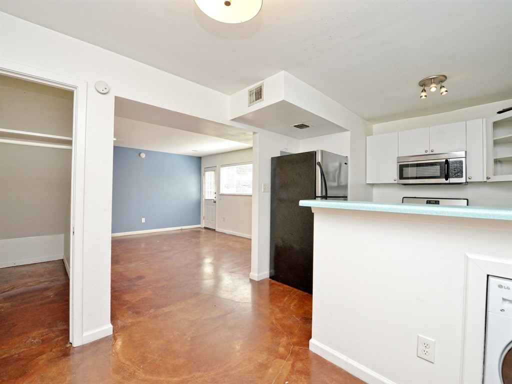 604 Franklin Boulevard, Unit A Austin, TX 78751 - Photo 11 of 20 a view of kitchen with refrigerator cabinets and wooden floor